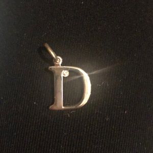 Dior D charm with Crystal.  Delicate.  Plated